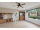 Bright living room featuring wood-look flooring and an entertainment center at 4720 E Elena Ave, Mesa, AZ 85206