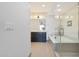 Spa-like bathroom with a soaking tub, glass-enclosed shower, and dual sink vanity at 4803 N Woodmere Fairway -- # 3009, Scottsdale, AZ 85251