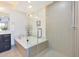 Luxurious bathroom featuring a glass-enclosed shower and soaking tub at 4803 N Woodmere Fairway -- # 3009, Scottsdale, AZ 85251