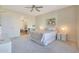Comfortable bedroom features a plush bed, soft lighting, and access to the ensuite bathroom at 4803 N Woodmere Fairway -- # 3009, Scottsdale, AZ 85251