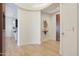 The entry foyer offers light wood floors and an adjacent view into the kitchen and breakfast bar at 4803 N Woodmere Fairway -- # 3009, Scottsdale, AZ 85251