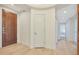 A light and airy foyer with an art niche and decorative wood door at 4803 N Woodmere Fairway -- # 3009, Scottsdale, AZ 85251