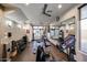 Well-equipped gym featuring modern exercise machines, weights, and mirrors for a complete fitness experience at 4803 N Woodmere Fairway -- # 3009, Scottsdale, AZ 85251