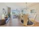 View of living area, dining area and a wall of windows bringing in natural light at 4803 N Woodmere Fairway -- # 3009, Scottsdale, AZ 85251