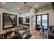 Inviting lounge area featuring modern seating, stylish decor, and seamless access to the kitchen and outdoor pool at 4803 N Woodmere Fairway -- # 3009, Scottsdale, AZ 85251