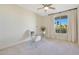 Bright office with a contemporary glass desk and large window at 4803 N Woodmere Fairway -- # 3009, Scottsdale, AZ 85251