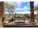 Cozy outdoor patio featuring comfortable seating, a modern fire pit, and scenic views at 4803 N Woodmere Fairway -- # 3009, Scottsdale, AZ 85251