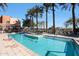 A stunning pool and spa area with lush palm trees and plenty of lounge chairs at 4803 N Woodmere Fairway -- # 3009, Scottsdale, AZ 85251