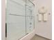 Modern shower featuring white subway tiles, glass door, and chrome fixtures at 4803 N Woodmere Fairway -- # 3009, Scottsdale, AZ 85251
