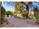 Paver patio with outdoor kitchen, seating, and fire pit, perfect for entertaining at 5234 E Carol Ave, Mesa, AZ 85206