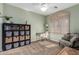 Neutral bedroom featuring window shutters, decorative shelves and furniture at 5234 E Carol Ave, Mesa, AZ 85206