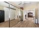 Spacious bedroom with expansive mirrored closet doors and carpet flooring at 5234 E Carol Ave, Mesa, AZ 85206