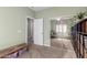 Bedroom with a mirror closet, shelving unit, and sitting area at 5234 E Carol Ave, Mesa, AZ 85206