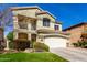 Charming two-story home with a well-manicured front lawn and a two-car garage and tiled roof at 5234 E Carol Ave, Mesa, AZ 85206