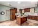 Gourmet kitchen with an island, custom cabinetry, and modern appliances at 5234 E Carol Ave, Mesa, AZ 85206