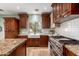 Bright kitchen with granite countertops, stainless steel appliances, and ample cabinet space at 5234 E Carol Ave, Mesa, AZ 85206