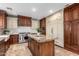 Well-appointed kitchen featuring a center island, stainless steel appliances, and ample storage at 5234 E Carol Ave, Mesa, AZ 85206