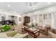 Spacious living room with a ceiling fan and a black piano at 5234 E Carol Ave, Mesa, AZ 85206