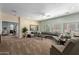 Spacious living room with comfortable seating, carpet flooring, and modern lighting at 5234 E Carol Ave, Mesa, AZ 85206