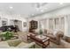 Cozy living room showcasing plush seating, a decorative cabinet, and a view of the staircase at 5234 E Carol Ave, Mesa, AZ 85206