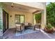 Covered outdoor patio with comfortable seating and stylish decor creating a cozy retreat at 5234 E Carol Ave, Mesa, AZ 85206