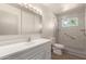 Bright bathroom featuring shower with safety bar at 5732 E Covina Rd, Mesa, AZ 85205