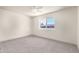 Bedroom featuring a large window and neutral walls at 5732 E Covina Rd, Mesa, AZ 85205
