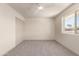 Carpeted bedroom with natural light at 5732 E Covina Rd, Mesa, AZ 85205