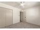 Bright bedroom with closet and updated carpeting at 5732 E Covina Rd, Mesa, AZ 85205