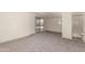 Bright bedroom featuring sliding glass doors and neutral carpeting at 5732 E Covina Rd, Mesa, AZ 85205