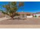 Charming single-story home with a well-maintained front yard and mature shade tree in front at 5732 E Covina Rd, Mesa, AZ 85205
