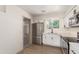Modern kitchen featuring stainless steel appliances, updated cabinets, and a view of the backyard at 5732 E Covina Rd, Mesa, AZ 85205