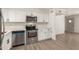 Modern kitchen with stainless appliances, shaker cabinets, and luxury countertops at 5732 E Covina Rd, Mesa, AZ 85205