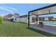 Green lawn with a covered patio, inviting pool, and a view of the modern home with mountain views at 5812 N 44Th Pl, Phoenix, AZ 85018