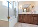 Elegant bathroom with a modern shower, soaking tub, and wooden vanity at 5812 N 44Th Pl, Phoenix, AZ 85018
