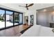 Bright bedroom featuring hardwood floors, and large sliding glass doors leading to a patio at 5812 N 44Th Pl, Phoenix, AZ 85018