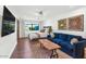 Bright bedroom with a plush blue sofa and a hardwood floor, perfect for relaxing at 5812 N 44Th Pl, Phoenix, AZ 85018