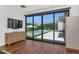 Bedroom with large sliding glass doors leading to a pool area with patio at 5812 N 44Th Pl, Phoenix, AZ 85018