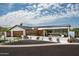 Stunning single-story home featuring a modern design, desert landscaping, and a three-car garage at 5812 N 44Th Pl, Phoenix, AZ 85018