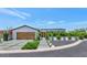 Charming modern home with manicured lawn, xeriscaped garden beds, and a two-car garage at 5812 N 44Th Pl, Phoenix, AZ 85018