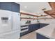 A kitchen featuring plenty of counter space and storage with a white fridge and oven at 5812 N 44Th Pl, Phoenix, AZ 85018