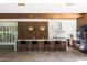 Modern kitchen with an island, pendant lighting, wine storage, and stainless steel appliances at 5812 N 44Th Pl, Phoenix, AZ 85018
