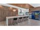 Modern kitchen with a large island, stylish lighting, and stainless-steel appliances at 5812 N 44Th Pl, Phoenix, AZ 85018