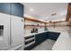 Well-organized kitchenette with integrated appliances, sleek countertops, and ample storage at 5812 N 44Th Pl, Phoenix, AZ 85018