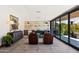 Bright living room featuring comfortable seating, elegant decor, and sliding glass doors to the patio at 5812 N 44Th Pl, Phoenix, AZ 85018