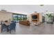 Open concept living area with a fireplace, tv, and a dining area with pool view at 5812 N 44Th Pl, Phoenix, AZ 85018