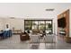 Inviting living space with large windows, comfortable seating, and seamless access to outdoor amenities at 5812 N 44Th Pl, Phoenix, AZ 85018
