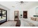 Spacious main bedroom with a large slider to the backyard, hardwood floors, and a view to the bathroom and closet at 5812 N 44Th Pl, Phoenix, AZ 85018