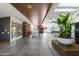 Spacious open floorplan with sleek tile flooring, modern lighting, and seamless transitions between living spaces at 5812 N 44Th Pl, Phoenix, AZ 85018