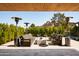 Inviting outdoor seating area with modern furniture, a covered patio, and lush greenery at 5812 N 44Th Pl, Phoenix, AZ 85018